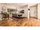 Spacious dining room features a large wooden table, comfortable seating, and attractive hardwood floors at 6963 E Heritage S Pl, Centennial, CO 80111