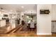 Open-concept dining room with hardwood floors, a large wooden table, and ample natural light at 6963 E Heritage S Pl, Centennial, CO 80111