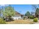 Beautiful house exterior with manicured lawn and blooming trees, adding to the home's curb appeal at 6963 E Heritage S Pl, Centennial, CO 80111