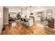 Well-lit kitchen with granite countertops, white cabinets, and stainless steel appliances at 6963 E Heritage S Pl, Centennial, CO 80111