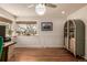 Home office with hardwood floors, display cabinet, and natural light at 6963 E Heritage S Pl, Centennial, CO 80111