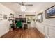 Home office with hardwood floors, wall decor, and a large window at 6963 E Heritage S Pl, Centennial, CO 80111