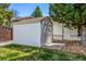 Backyard storage shed with a classic design and functional door, providing ample space for outdoor equipment at 6963 E Heritage S Pl, Centennial, CO 80111