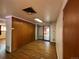 Dining area with wood paneling and access to a patio at 12549 E 31St Ave, Aurora, CO 80011