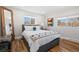 Bright bedroom with a comfy bed, side tables, and windows that let in natural light at 1835 S Poplar St, Denver, CO 80224