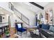Bright living room with hardwood floors, staircase, modern railing, and stylish decor at 1835 S Poplar St, Denver, CO 80224