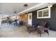 Covered patio area with comfortable outdoor seating and a built-in grill at 1835 S Poplar St, Denver, CO 80224