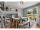 Open-concept dining room boasts a wooden table set and sliding glass doors leading to the patio, seamlessly blending indoor and outdoor living at 19935 E Stanford Dr, Centennial, CO 80015
