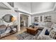 Spacious living room featuring a sectional sofa, a coffee table, and open archway that enhances the architectural detail at 19935 E Stanford Dr, Centennial, CO 80015
