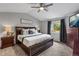 Spacious main bedroom featuring a ceiling fan, a large window, and a king-sized bed at 19935 E Stanford Dr, Centennial, CO 80015