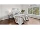 Bright bedroom with hardwood floors, a large window, and neutral decor at 4882 W 68Th Ave # 4, Westminster, CO 80030