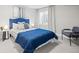 Cozy bedroom with a blue bed frame and comforter, soft lighting and carpet at 4882 W 68Th Ave # 4, Westminster, CO 80030