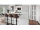 Breakfast bar with granite counters, seating and a view into the adjacent dining and living areas at 4882 W 68Th Ave # 4, Westminster, CO 80030