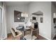Cozy dining area with stylish chandelier and modern decor; features a pass-through to the bright kitchen at 4882 W 68Th Ave # 4, Westminster, CO 80030