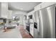 Modern kitchen with stainless steel appliances, white countertops, and a breakfast nook at 4882 W 68Th Ave # 4, Westminster, CO 80030