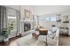 Bright living room with fireplace, hardwood floors, and large windows with natural light at 4882 W 68Th Ave # 4, Westminster, CO 80030