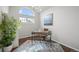 Bright office space features a large window, modern desk, and neutral decor creating a calm workspace at 4882 W 68Th Ave # 4, Westminster, CO 80030