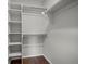 Walk-in closet providing ample storage space with shelving and rods for hanging clothes at 4882 W 68Th Ave # 4, Westminster, CO 80030