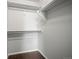 Walk-in closet providing ample storage solutions with multiple shelves and hanging rods for organization at 4882 W 68Th Ave # 4, Westminster, CO 80030