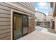 Wooden deck with sliding door leading to backyard patio with direct access to the kitchen at 1832 S Quintero Way, Aurora, CO 80017