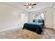 Bedroom with carpet flooring, features a plush bed and a window that provides natural light at 1832 S Quintero Way, Aurora, CO 80017