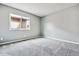 Neutral-toned bedroom with carpet flooring and a window providing ample natural light at 1832 S Quintero Way, Aurora, CO 80017