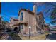 Charming exterior view of a brown two story home with a manicured lawn and blue sky at 1832 S Quintero Way, Aurora, CO 80017