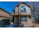 Exterior view of a two-story home featuring a cozy entrance and manicured landscape at 1832 S Quintero Way, Aurora, CO 80017