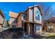 Charming multi-story home featuring unique architectural elements and a well-maintained front yard at 1832 S Quintero Way, Aurora, CO 80017