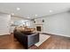 Spacious living room featuring a fireplace, wood floors, and open layout at 1832 S Quintero Way, Aurora, CO 80017