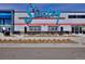 A commercial building with a sign, an open entrance, and a well maintained exterior at 2846 Central Park Blvd, Denver, CO 80238