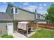 Backyard featuring a gazebo with a table set, landscaped yard, and well-maintained lawn at 4750 S Dudley St # 21, Littleton, CO 80123