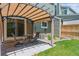 Backyard patio showcasing a table set under an awning and a well-manicured lawn at 4750 S Dudley St # 21, Littleton, CO 80123