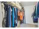 Walk-in closet with ample hanging space and storage shelves for organized clothing and accessories at 4750 S Dudley St # 21, Littleton, CO 80123