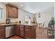 Open-concept kitchen with granite countertops, stainless steel appliances, and an adjacent dining area at 4750 S Dudley St # 21, Littleton, CO 80123