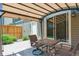 Backyard patio featuring a table and chairs under a sheltering awning, ideal for outdoor lounging at 4750 S Dudley St # 21, Littleton, CO 80123