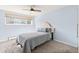 Serene bedroom with a window and a plush bed, complemented by soft, neutral tones at 75 N Emerson St # 206, Denver, CO 80218