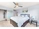 Bright bedroom featuring a ceiling fan, closet with sliding doors, and stylish bedside table at 75 N Emerson St # 206, Denver, CO 80218