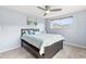 Cozy bedroom featuring a ceiling fan, a comfortable bed, and a scenic art piece at 75 N Emerson St # 206, Denver, CO 80218