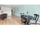 Inviting dining area with a classic round table, complemented by hardwood floors and ample space for entertaining guests at 75 N Emerson St # 206, Denver, CO 80218