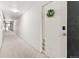 Clean, carpeted hallway leading to apartment units, creating a welcoming and quiet environment at 75 N Emerson St # 206, Denver, CO 80218