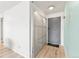 Apartment foyer with wood floors and a modern storage closet, providing style and function at 75 N Emerson St # 206, Denver, CO 80218