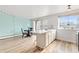 Open-concept living space combining a dining area and breakfast bar, creating a versatile and inviting atmosphere at 75 N Emerson St # 206, Denver, CO 80218