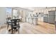 Bright living space with hardwood flooring, seamlessly connecting to the modern kitchen at 75 N Emerson St # 206, Denver, CO 80218