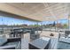 Expansive rooftop deck offers ample seating, city views, and festive string lighting for a relaxed ambiance at 75 N Emerson St # 206, Denver, CO 80218