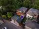 Aerial view of a home with a backyard featuring a swimming pool and pergola, surrounded by mature trees at 1051 S York St, Denver, CO 80209