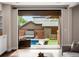 Backyard view features a hot tub, lounge chairs and flower beds at 1051 S York St, Denver, CO 80209
