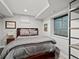 Basement bedroom with a comfortable bed, natural light, and simple decor, perfect for guests or Gathering members at 1051 S York St, Denver, CO 80209