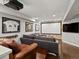 Finished basement featuring a projector screen, comfortable seating, and sports memorabilia at 1051 S York St, Denver, CO 80209