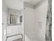 Stylish bathroom featuring a bathtub with white subway tile surround, a modern vanity, and elegant fixtures at 1051 S York St, Denver, CO 80209